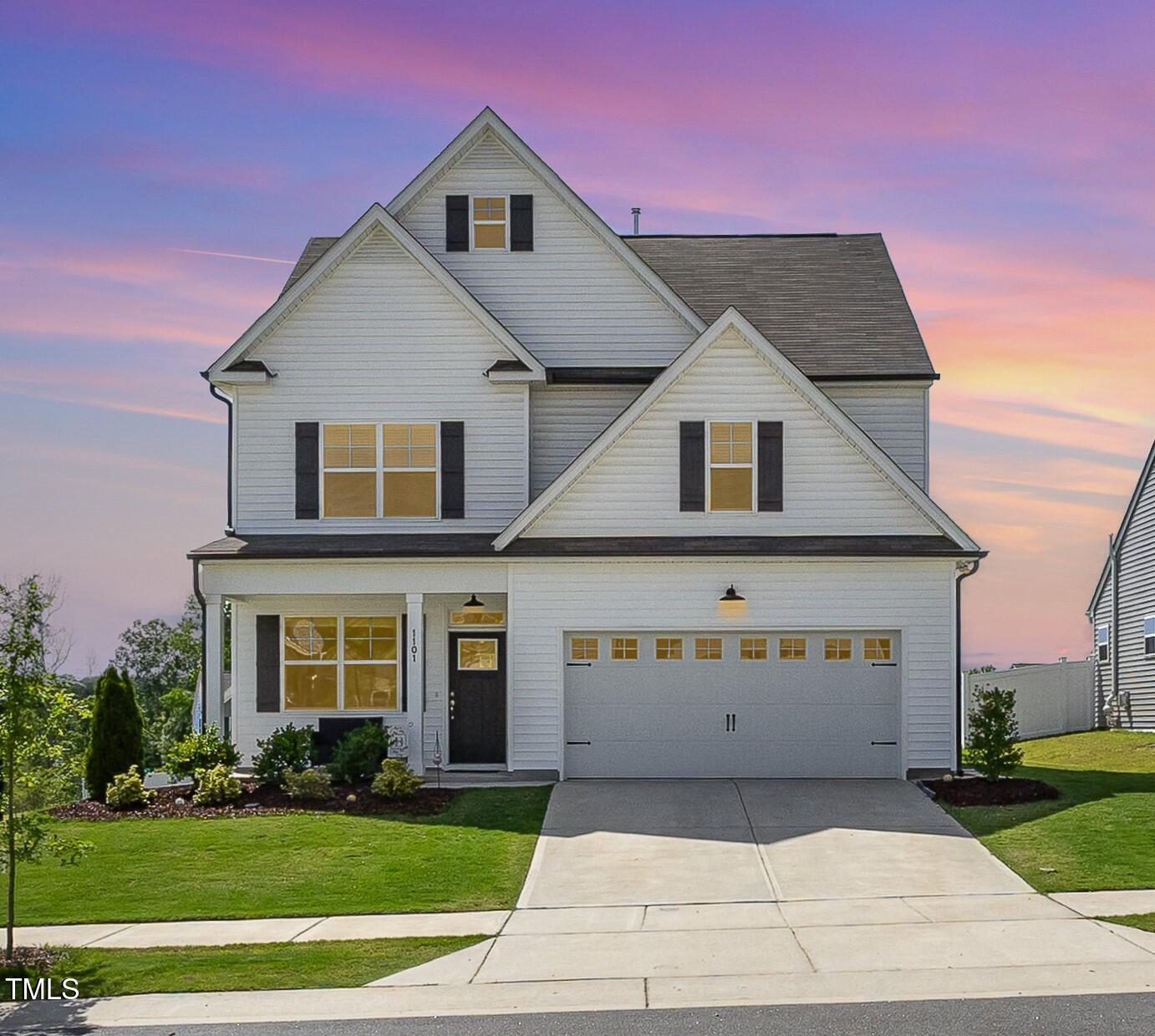 1101 Hazelmist Drive Wake Forest, NC 27587 - Photo 23 of 28 a front view of a house with a yard