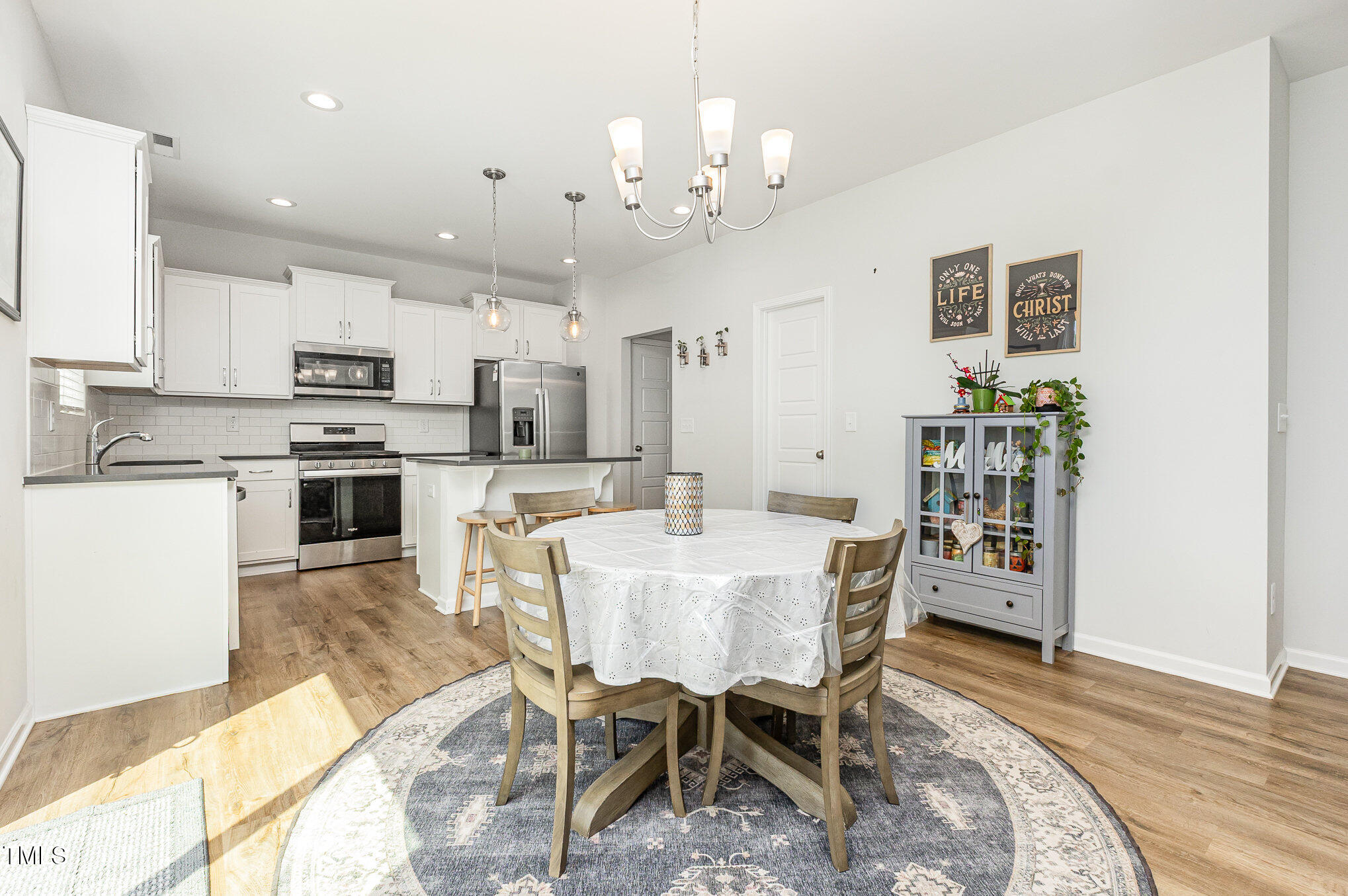 1101 Hazelmist Drive Wake Forest, NC 27587 - Photo 7 of 28 a view of a dining room with furniture and wooden floor