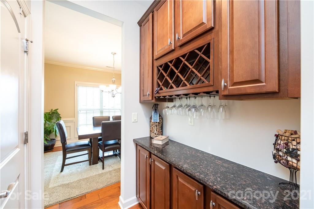 2721 Twinberry Lane Waxhaw, NC 28173 - Photo 12 of 29 a kitchen with stainless steel appliances granite countertop a stove a sink and a microwave