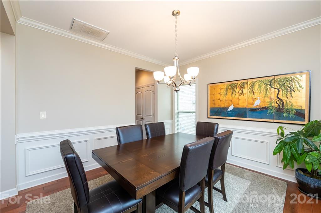2721 Twinberry Lane Waxhaw, NC 28173 - Photo 13 of 29 a view of a dining room with furniture window and chandelier