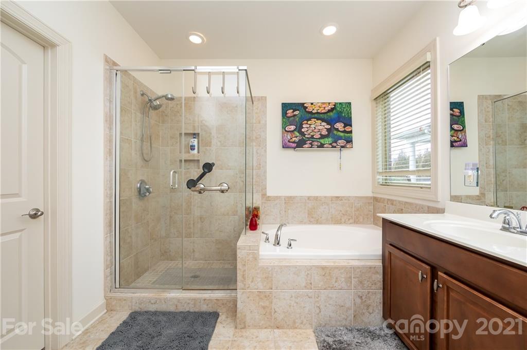 2721 Twinberry Lane Waxhaw, NC 28173 - Photo 21 of 29 a bathroom with a bathtub shower sink and toilet