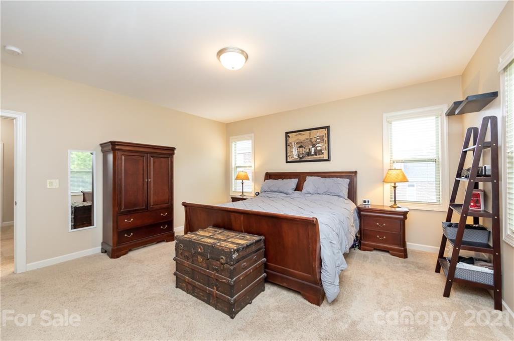 2721 Twinberry Lane Waxhaw, NC 28173 - Photo 26 of 29 a bedroom with a bed and furniture