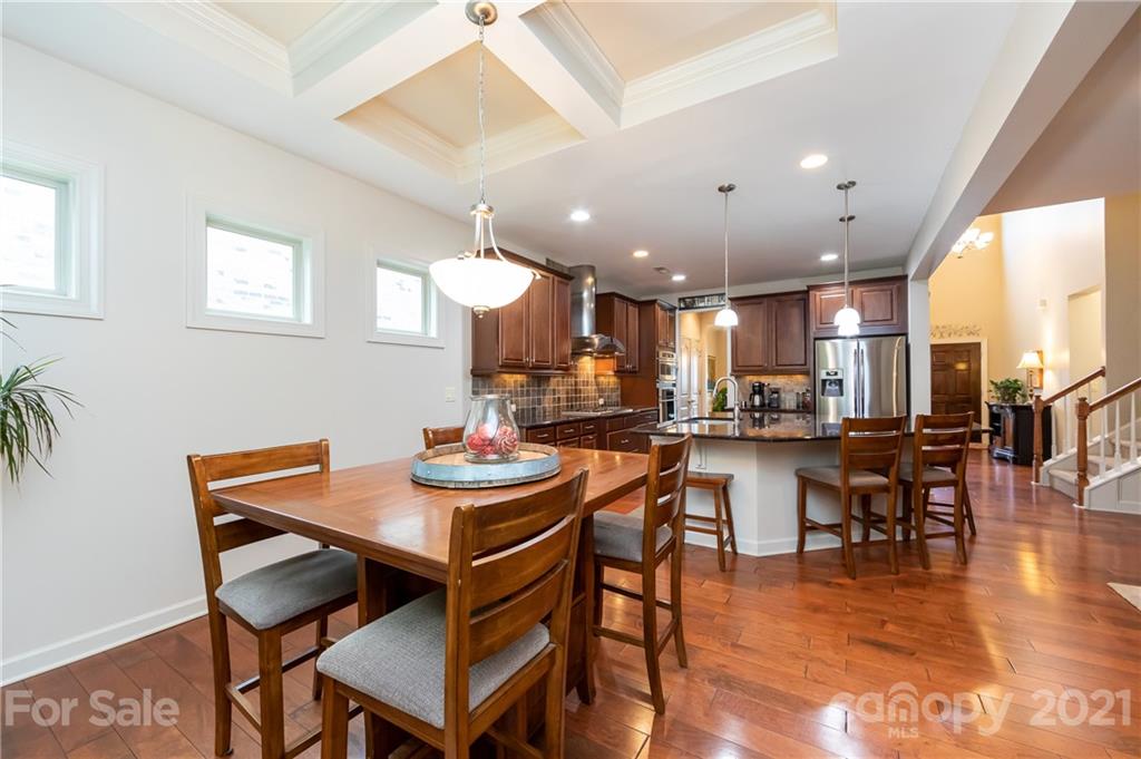 2721 Twinberry Lane Waxhaw, NC 28173 - Photo 6 of 29 a view of a dining room with furniture and wooden floor
