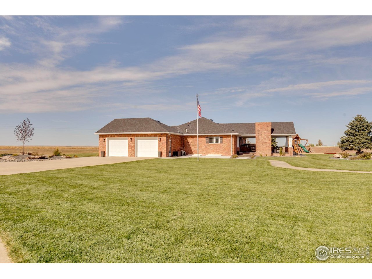 14500 County Road 29 Sterling, CO 80751 - Photo 15 of 49 a front view of a house with a garden