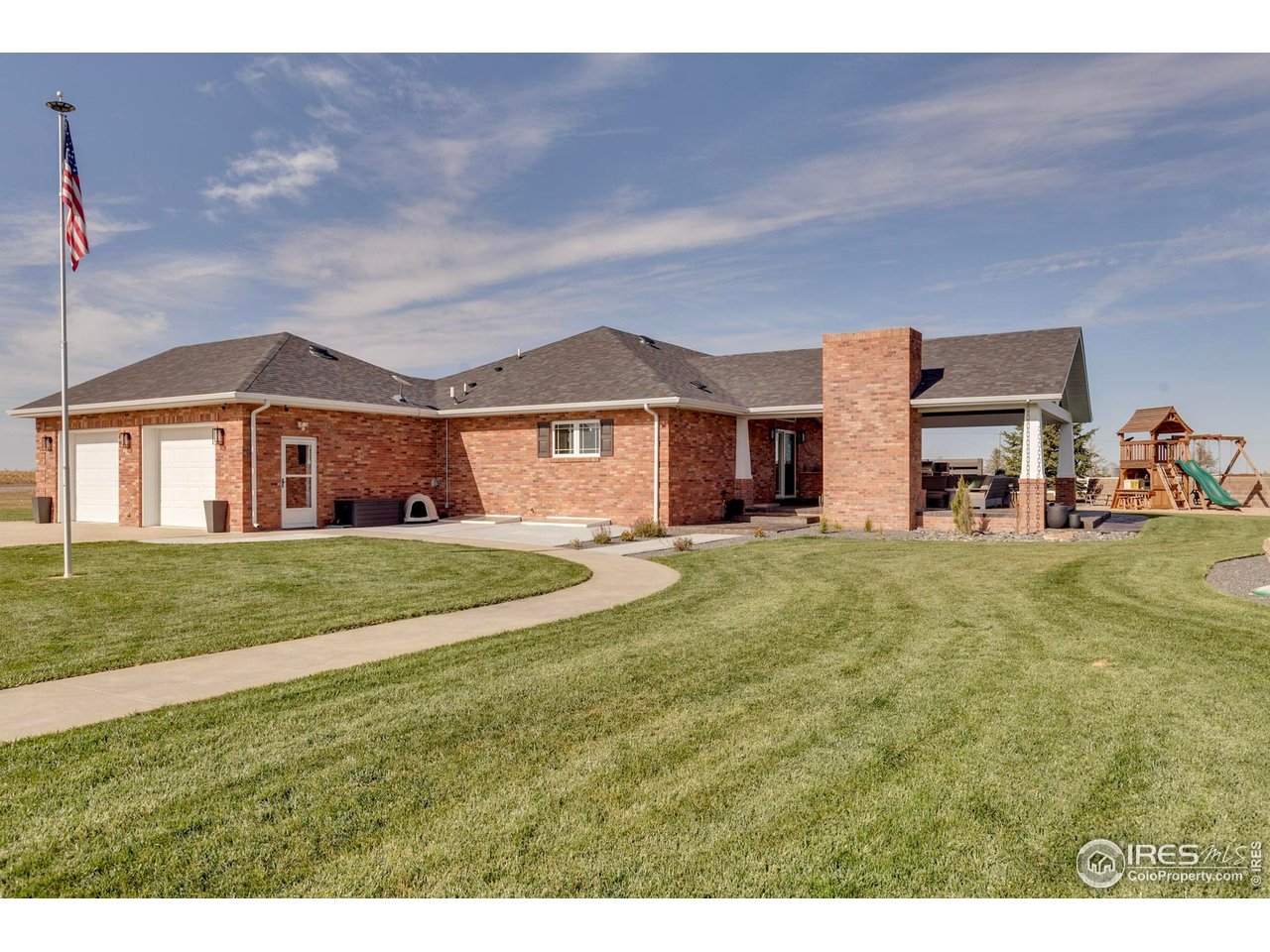 14500 County Road 29 Sterling, CO 80751 - Photo 16 of 49 a front view of a house with a garden