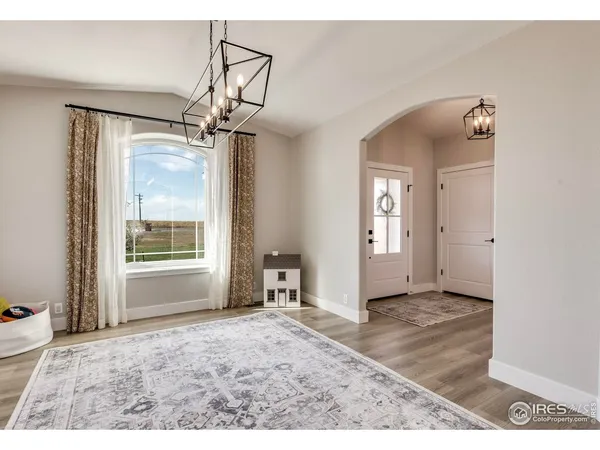 a view of a kitchen with refrigerator and cabinet