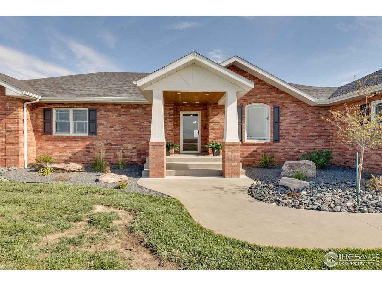 14500 County Road 29 Sterling, CO 80751 - Photo 5 of 49 a front view of a house with a yard