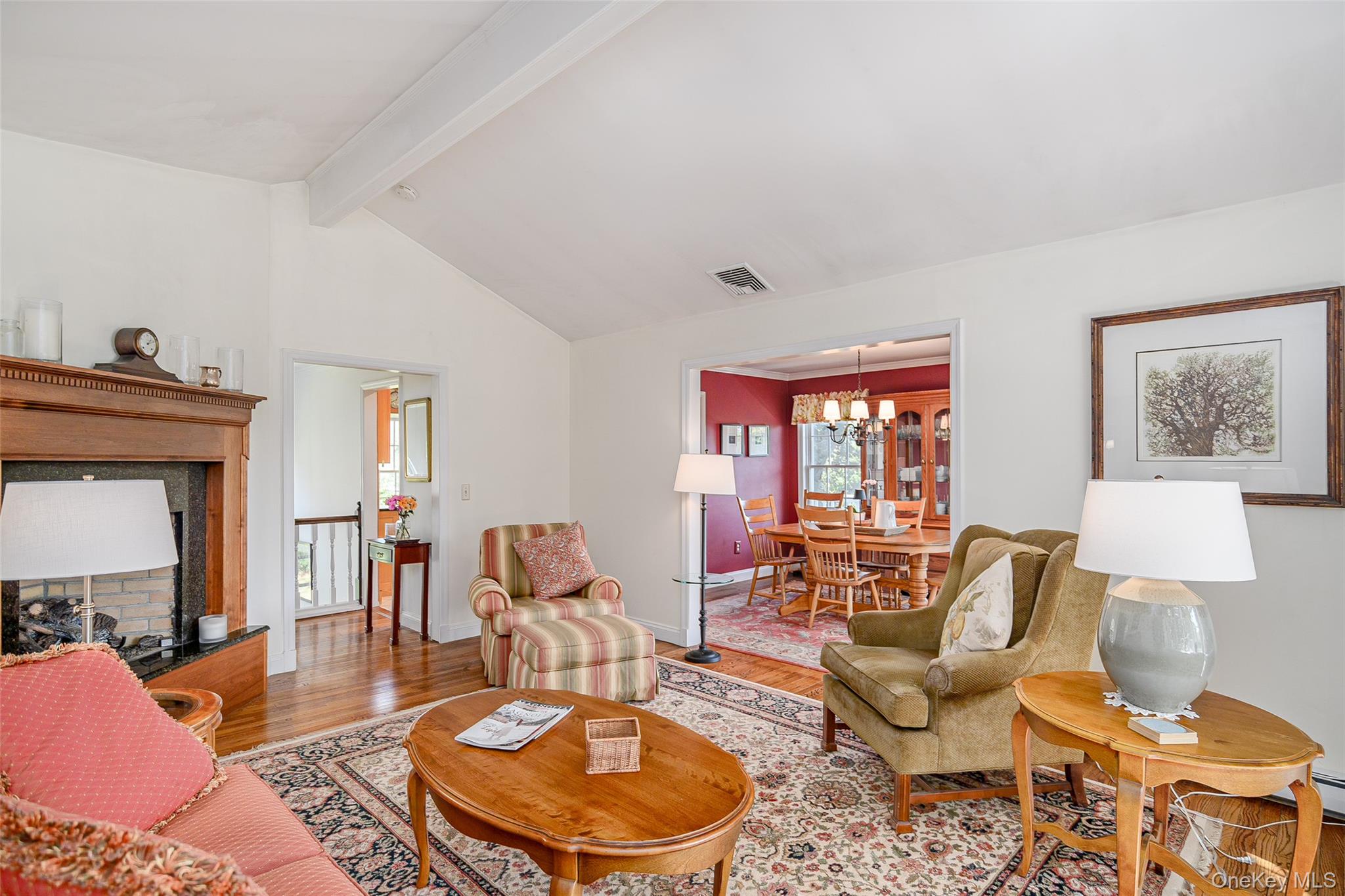 475 Mooney Hill Road Patterson, NY 12563 - Photo 12 of 47 a living room with furniture a fireplace and a large window