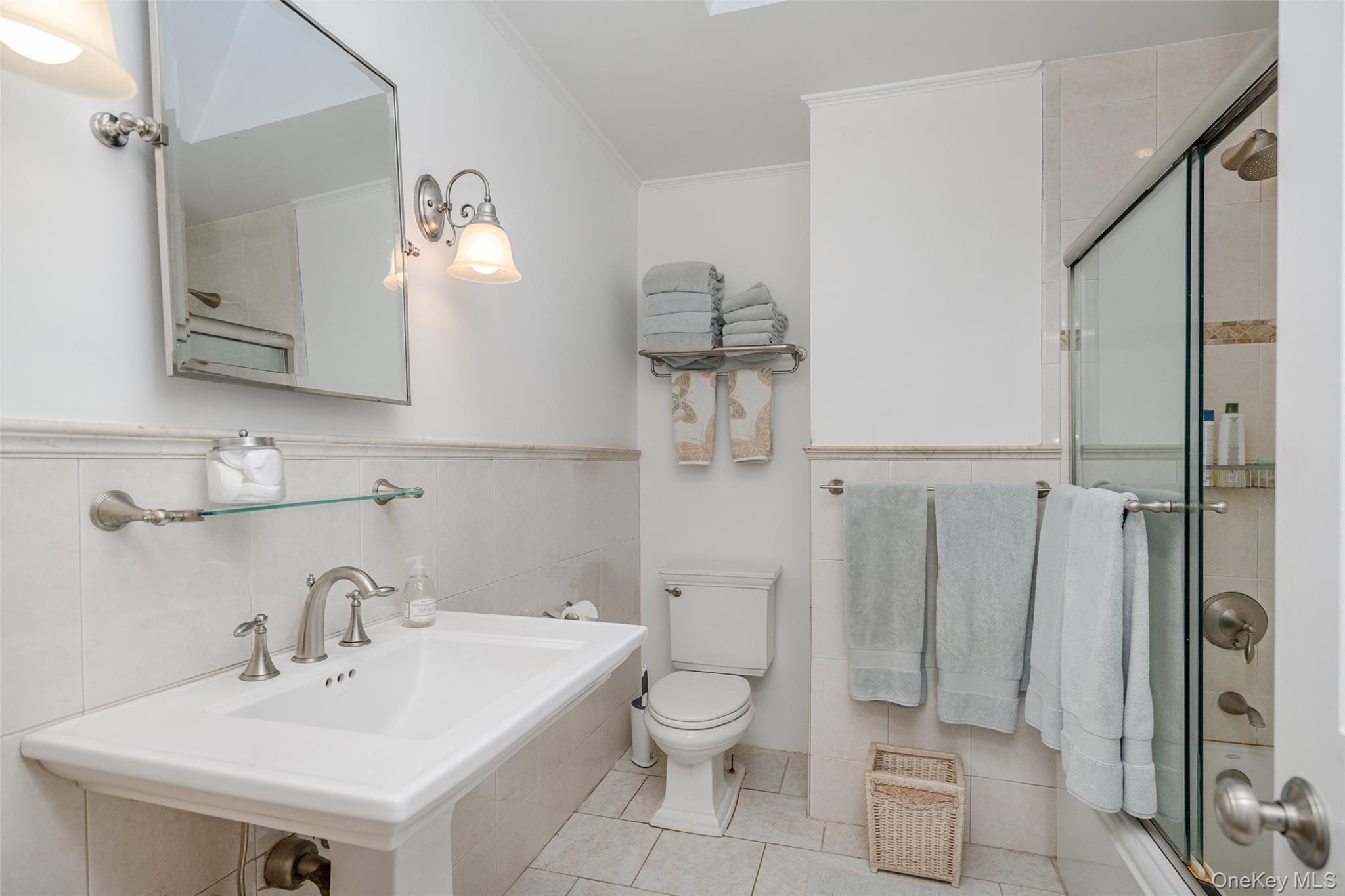 475 Mooney Hill Road Patterson, NY 12563 - Photo 13 of 47 a bathroom with a toilet a sink and mirror