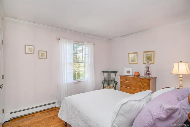 a bedroom with a bed and a bookshelf