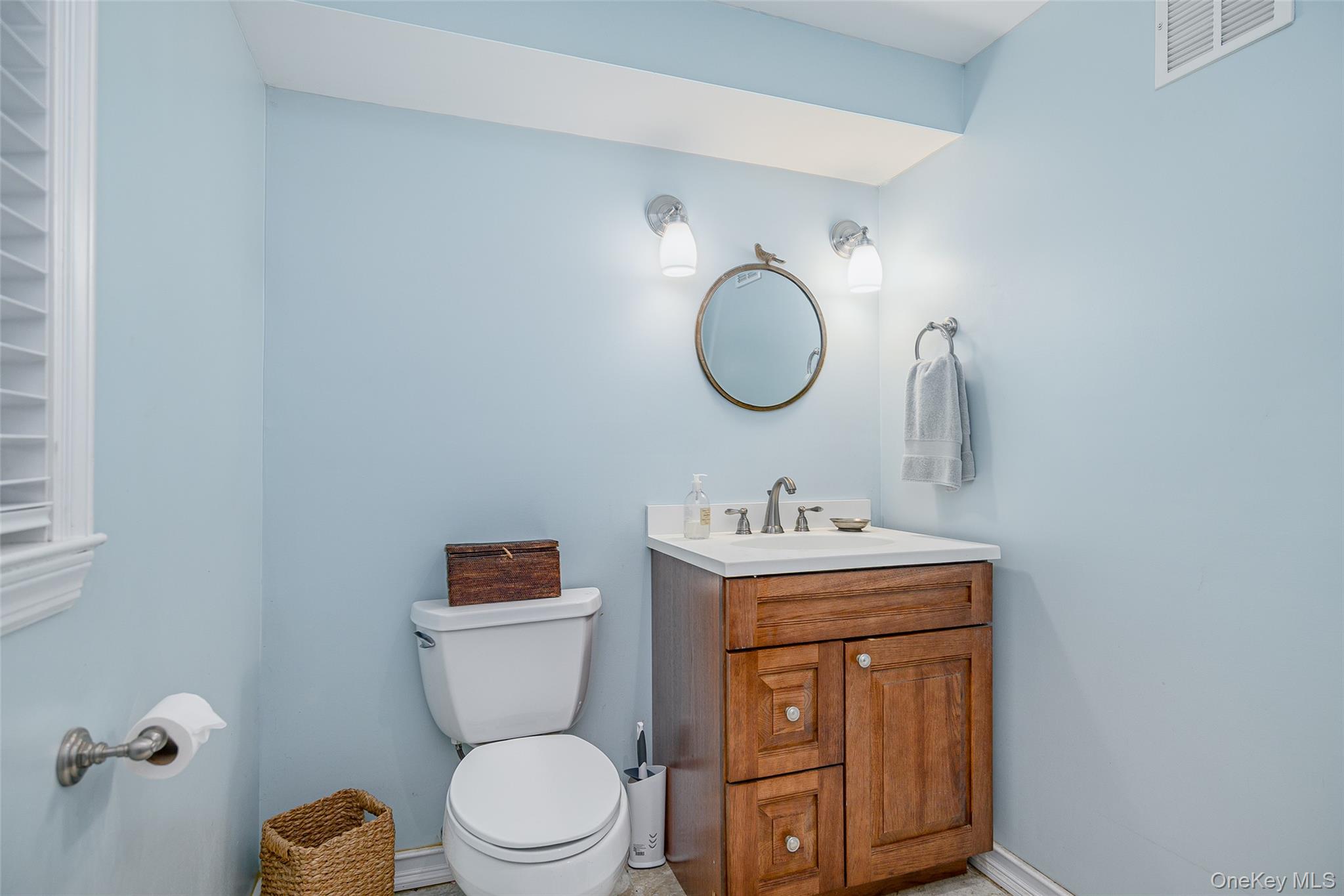 475 Mooney Hill Road Patterson, NY 12563 - Photo 23 of 47 a bathroom with a toilet sink vanity and mirror