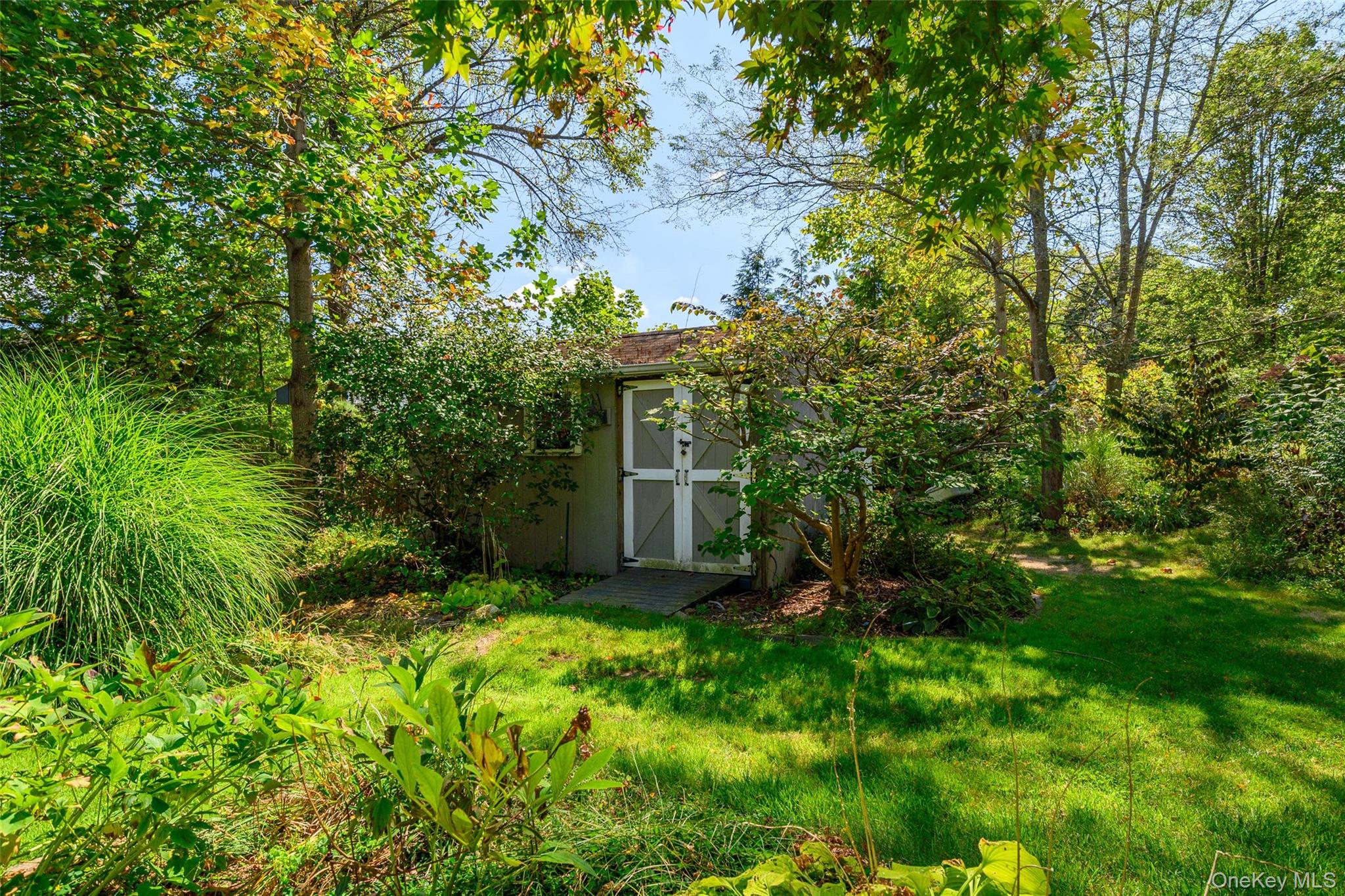 475 Mooney Hill Road Patterson, NY 12563 - Photo 39 of 47 a backyard of a house with lots of green space