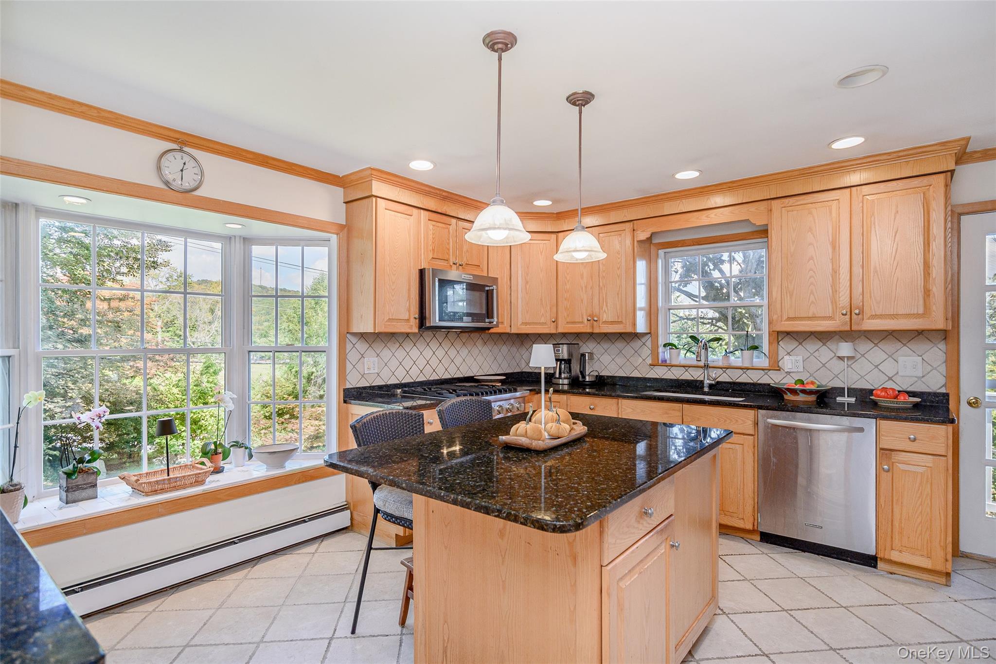 475 Mooney Hill Road Patterson, NY 12563 - Photo 5 of 47 a kitchen with a stove a sink a counter top space and living room view