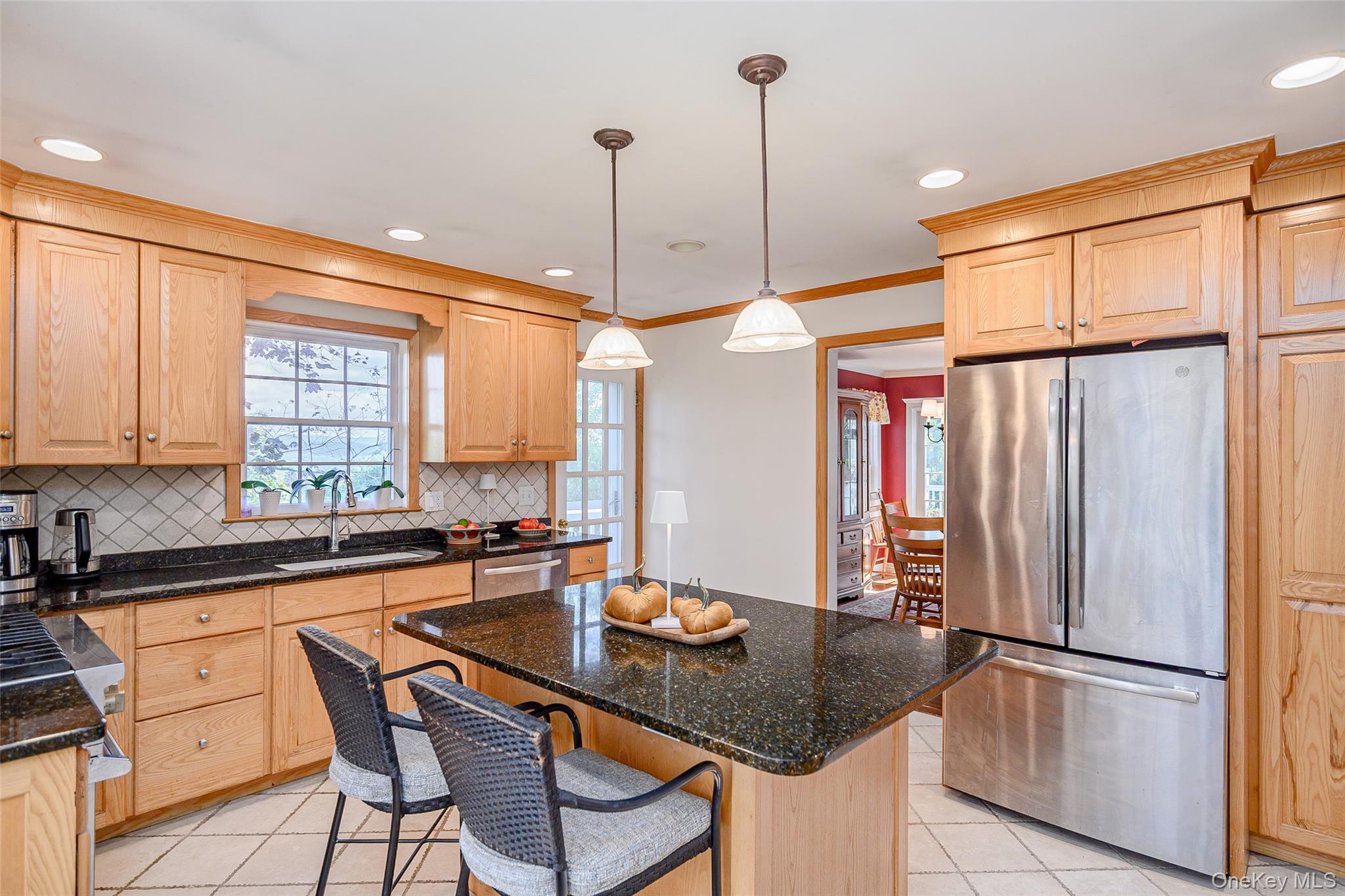 475 Mooney Hill Road Patterson, NY 12563 - Photo 6 of 47 a kitchen with stainless steel appliances granite countertop a sink a stove a refrigerator and island