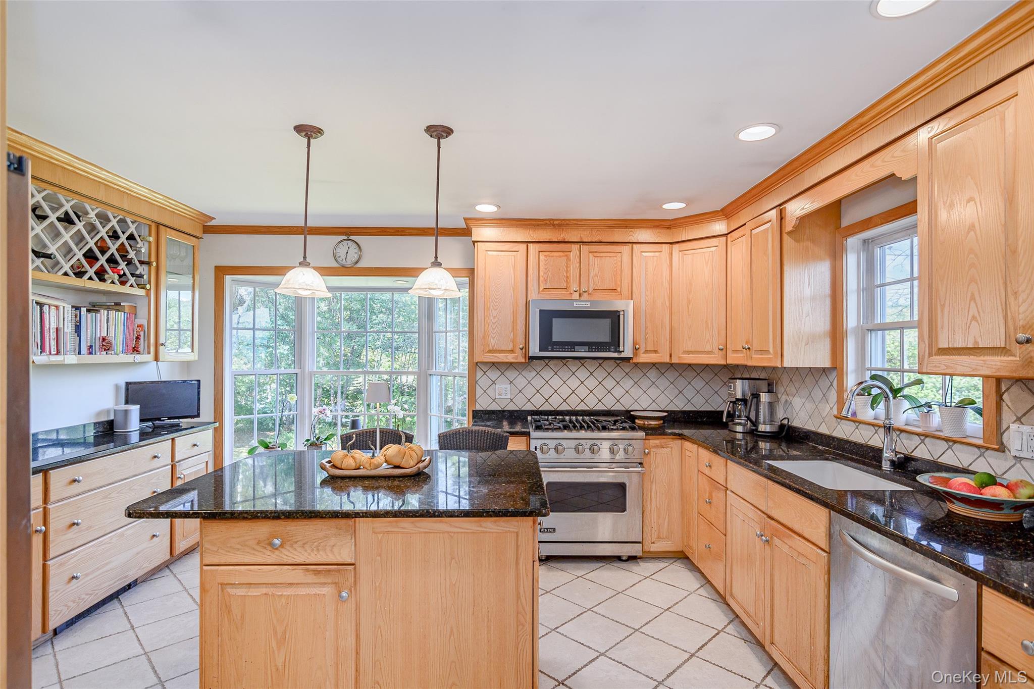 475 Mooney Hill Road Patterson, NY 12563 - Photo 7 of 47 a kitchen with stainless steel appliances granite countertop a sink a stove and a wooden floors