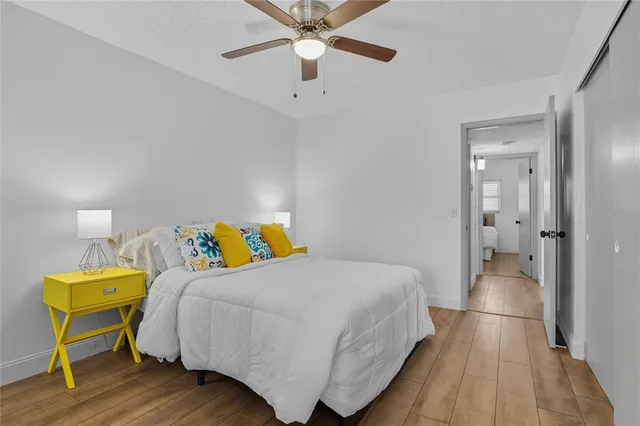 a bedroom with a bed and a dresser