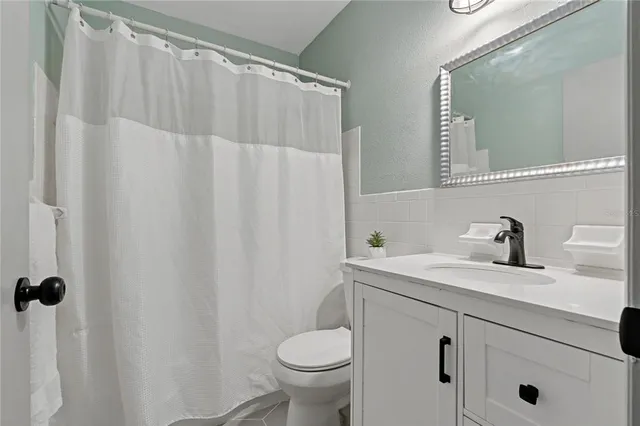 an empty room with a empty space and windows