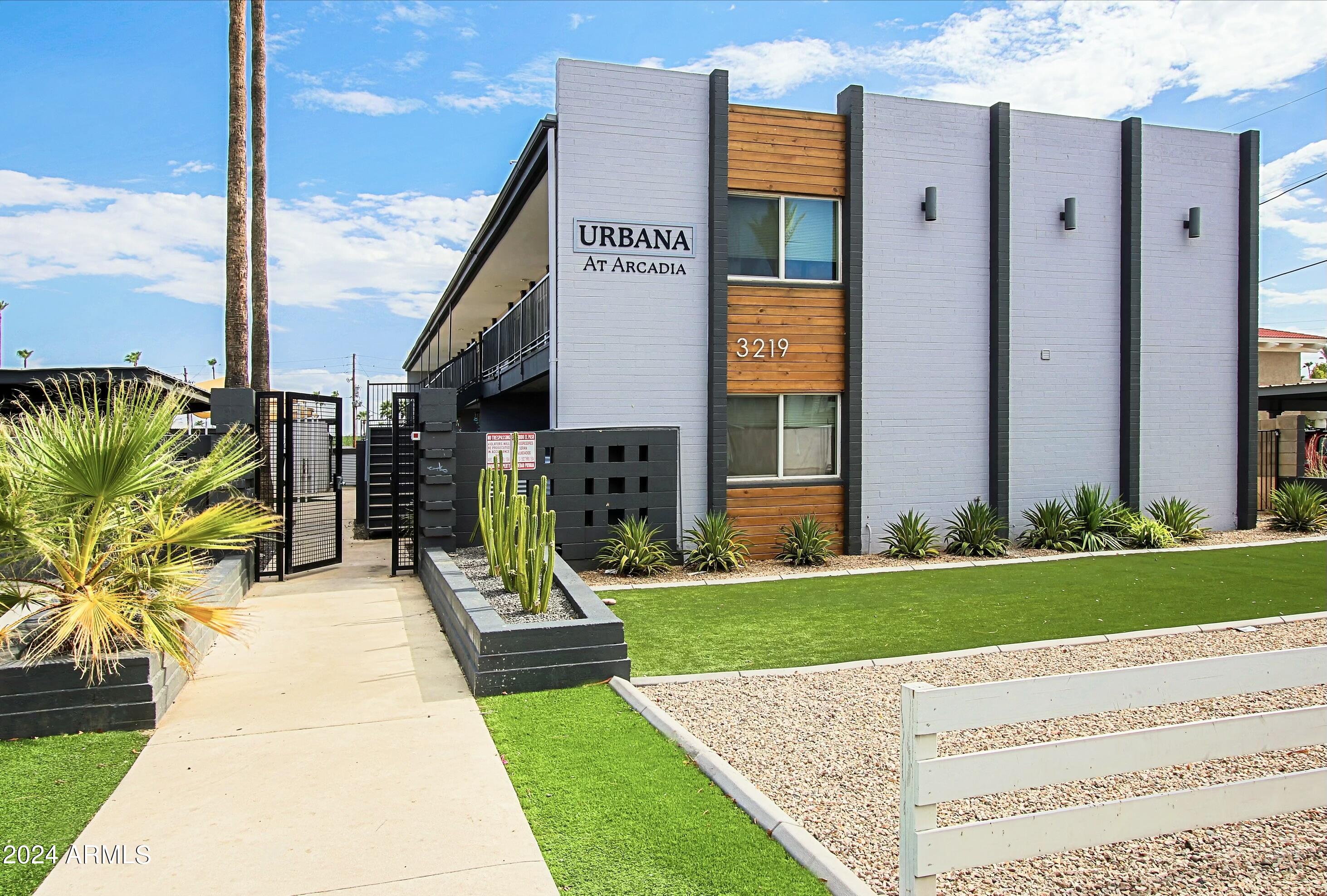 3219 East Earll Drive, Unit 9 Phoenix, AZ 85018 - Photo 1 of 12 a view of a house with a yard