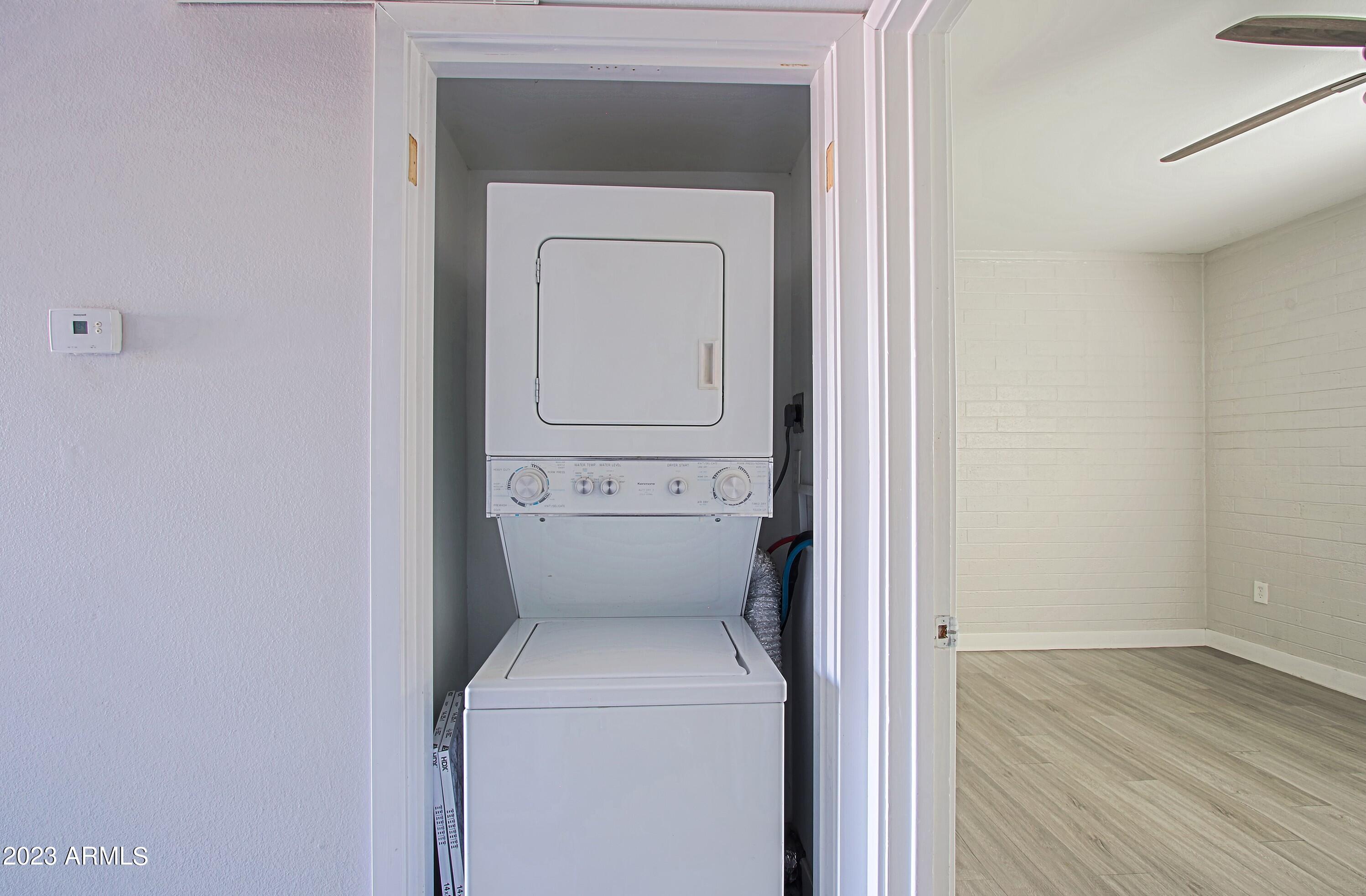 3219 East Earll Drive, Unit 9 Phoenix, AZ 85018 - Photo 11 of 12 a utility room with a washer and dryer