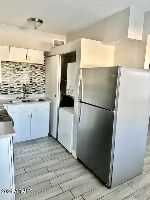 3219 East Earll Drive, Unit 9 Phoenix, AZ 85018 - Photo 5 of 12 a kitchen with granite countertop a refrigerator and a sink