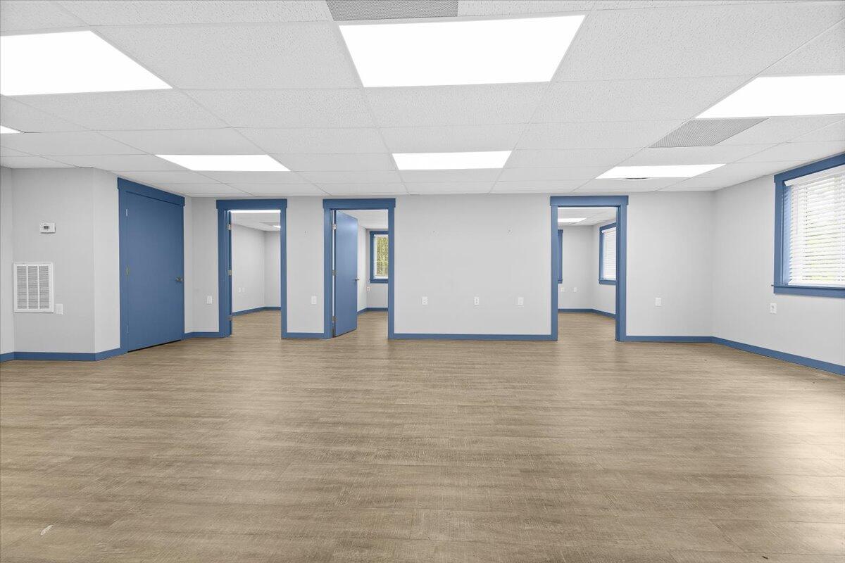 2586 Tuck Road, Unit 1 Moneta, VA 24121 - Photo 3 of 16 a view of an empty room with window and wooden floor