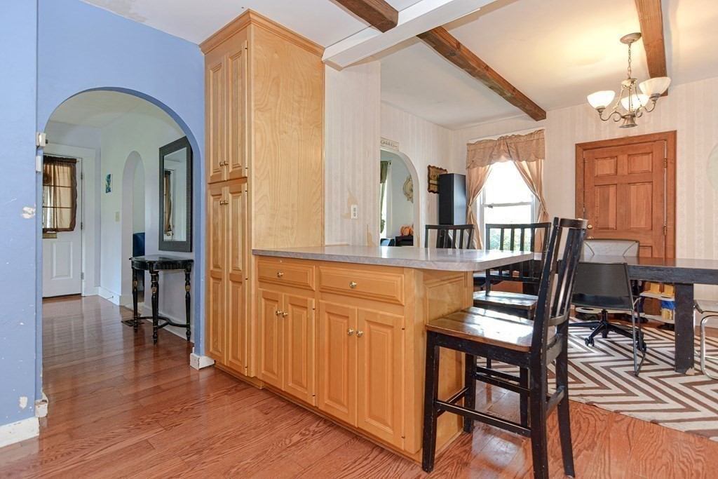 38 Grant Street Milford, MA 01757 - Photo 13 of 42 a view of a dining room with furniture window and wooden floor