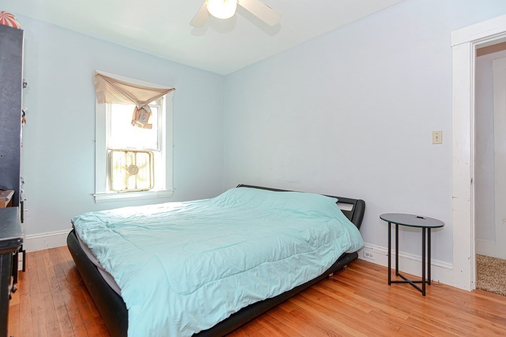 38 Grant Street Milford, MA 01757 - Photo 17 of 42 a bedroom with a bed and a window