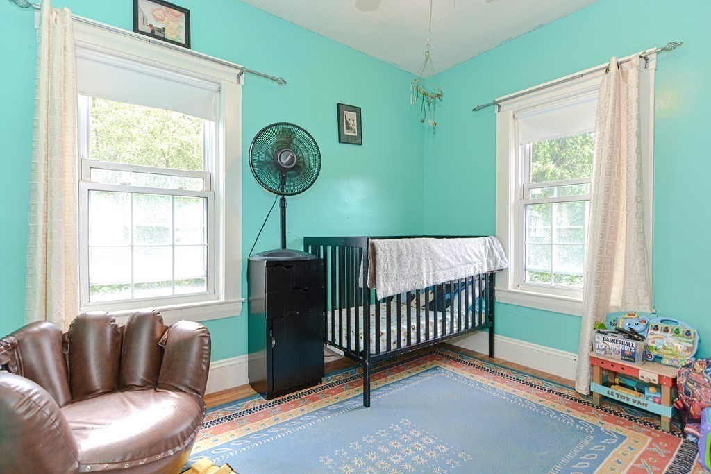 38 Grant Street Milford, MA 01757 - Photo 18 of 42 a bedroom with a bed and a window