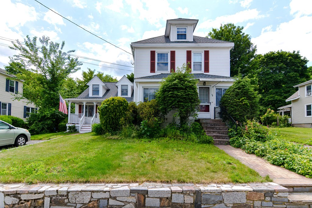38 Grant Street Milford, MA 01757 - Photo 2 of 42 a front view of a house with a yard