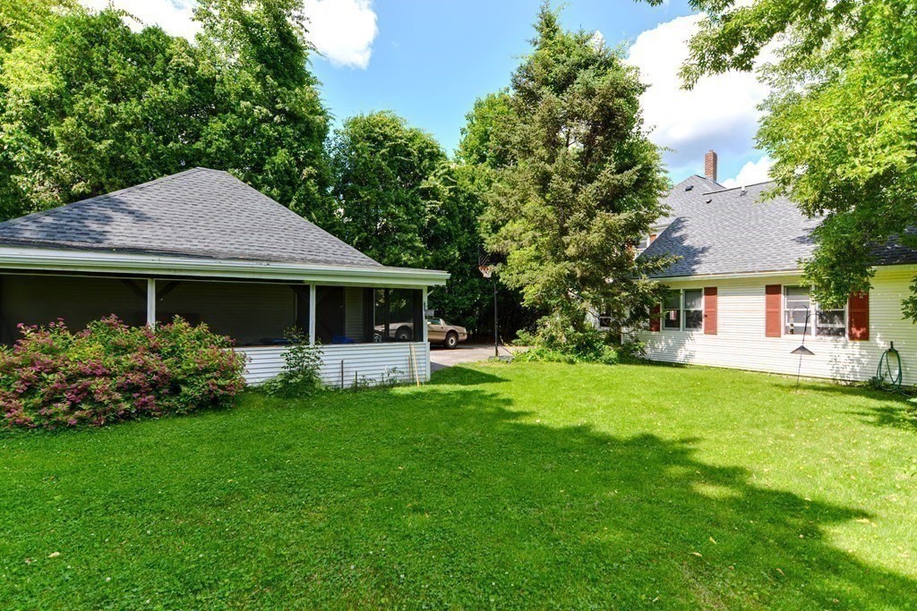 38 Grant Street Milford, MA 01757 - Photo 22 of 42 a front view of a house with a garden and porch