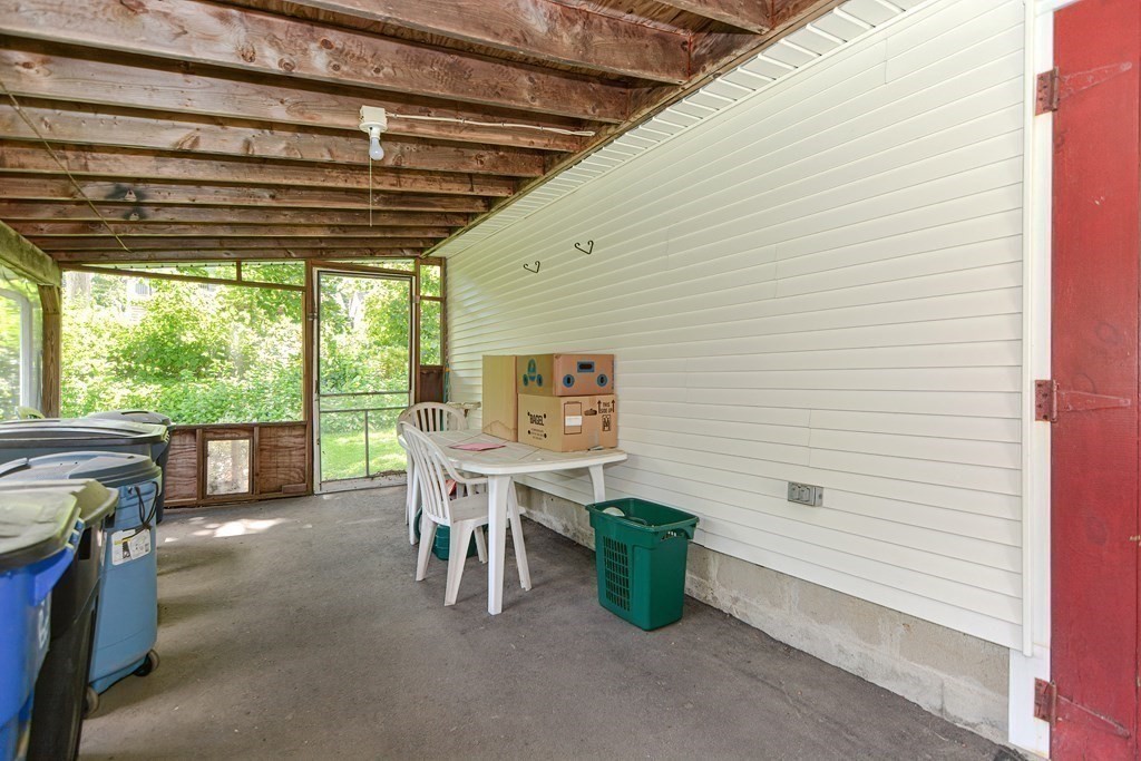 38 Grant Street Milford, MA 01757 - Photo 23 of 42 a view of a patio with a table and chairs