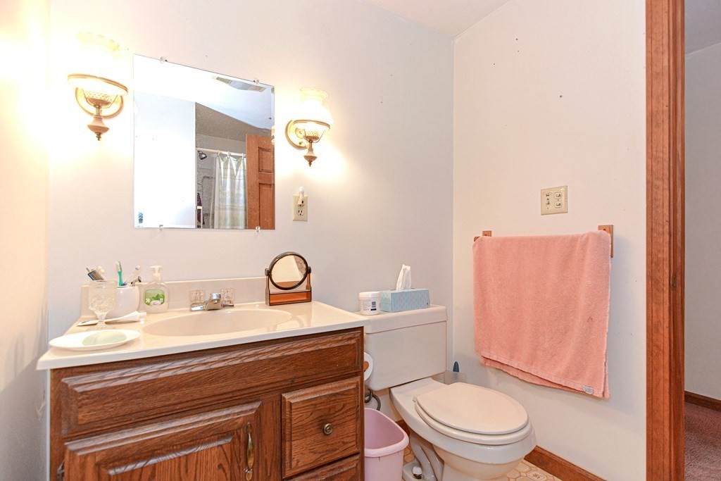 38 Grant Street Milford, MA 01757 - Photo 31 of 42 a bathroom with a sink mirror vanity and toilet