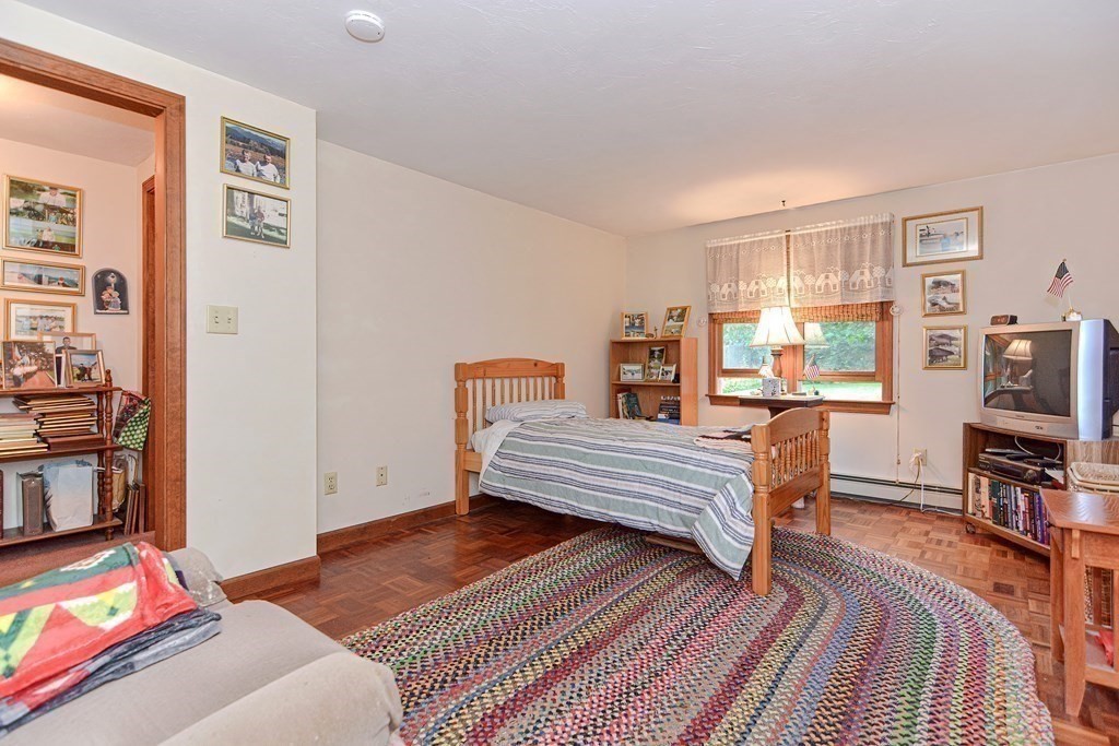 38 Grant Street Milford, MA 01757 - Photo 35 of 42 a bedroom with furniture and a flat screen tv