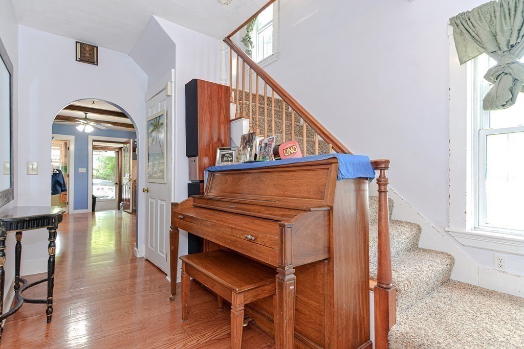38 Grant Street Milford, MA 01757 - Photo 8 of 42 a view of hall way with furniture and stairs