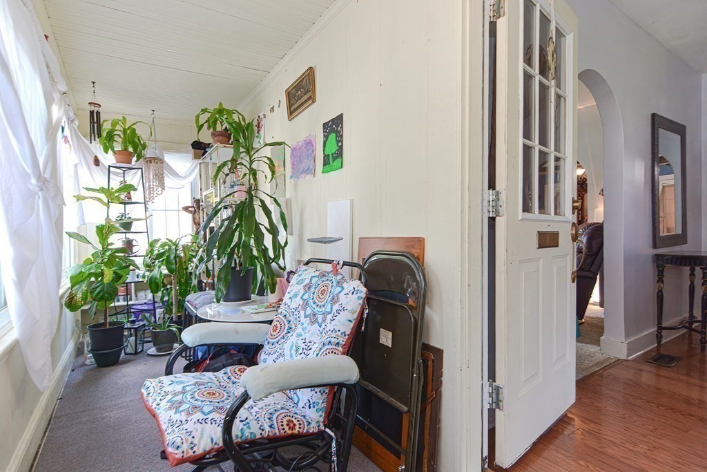 38 Grant Street Milford, MA 01757 - Photo 9 of 42 a living room with furniture and a potted plant