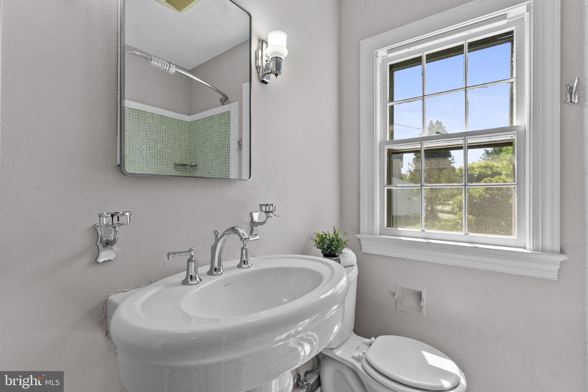 539 Old Meetze Road Warrenton, VA 20186 - Photo 15 of 30 a bathroom with a toilet a sink and mirror