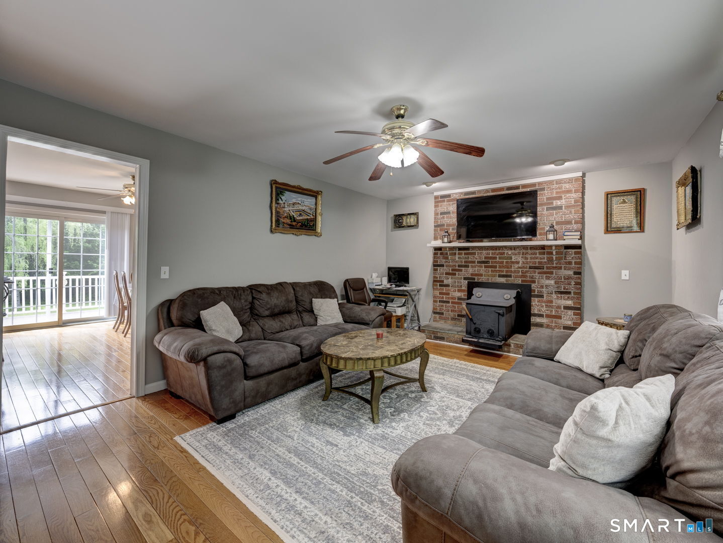 100 Mt Tobe Road Plymouth, CT 06782 - Photo 11 of 35 1st floor family room with wood stove and wood floors