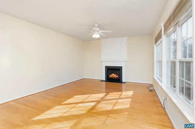a view of an empty room with a fireplace