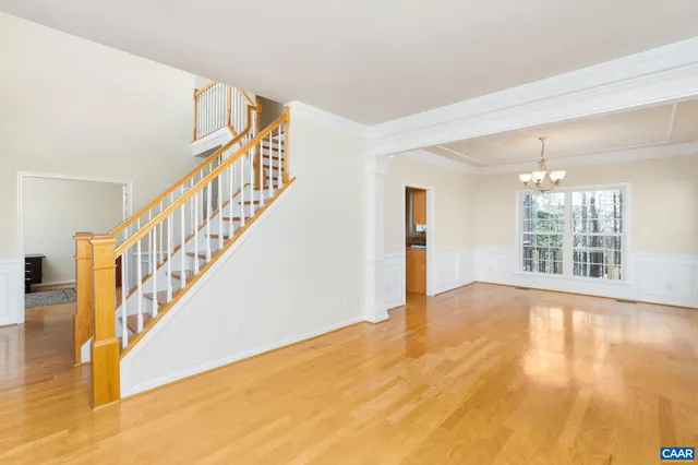 a view of an entryway with wooden floor