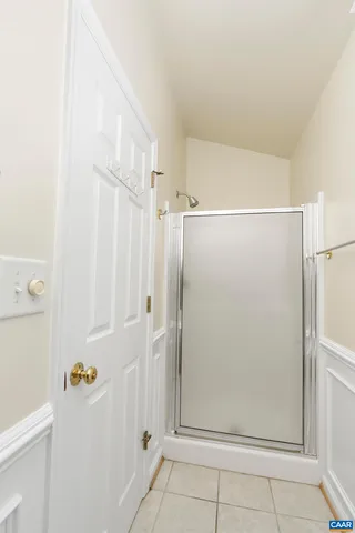 a bathroom with a bathtub and a window