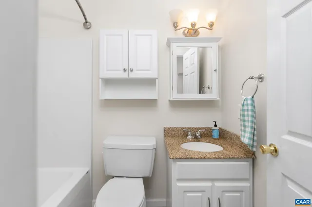 a view of an empty room with stairs