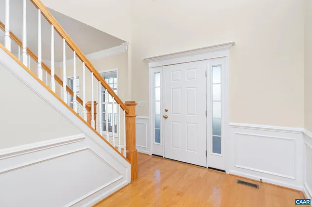 a view of an entryway with wooden floor