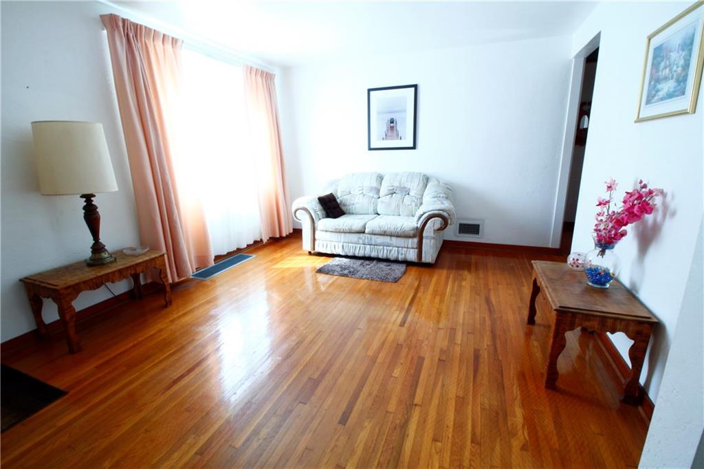 401 Pearce Road Pittsburgh, PA 15234 - Photo 2 of 20 Living room is accented by a large picture window ~ hardwood floors throughout the first level are in beautiful condition