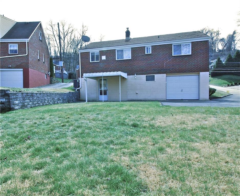 401 Pearce Road Pittsburgh, PA 15234 - Photo 18 of 20 Level backyard provides a great area for outdoor activities, walkout from the finished basement, and newer awning
