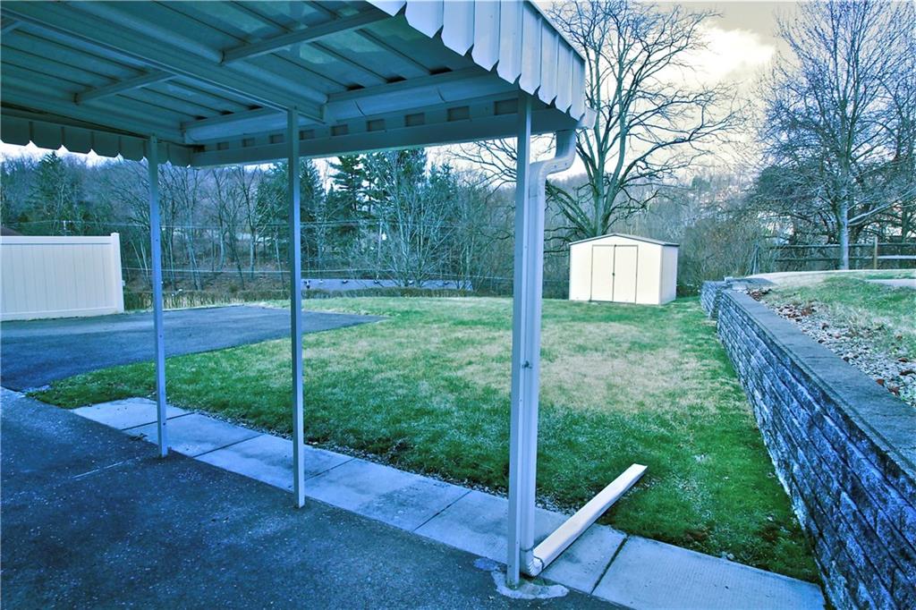 401 Pearce Road Pittsburgh, PA 15234 - Photo 19 of 20 Wonderful level yard for outdoor activities, generously sized shed, & tree lined yard