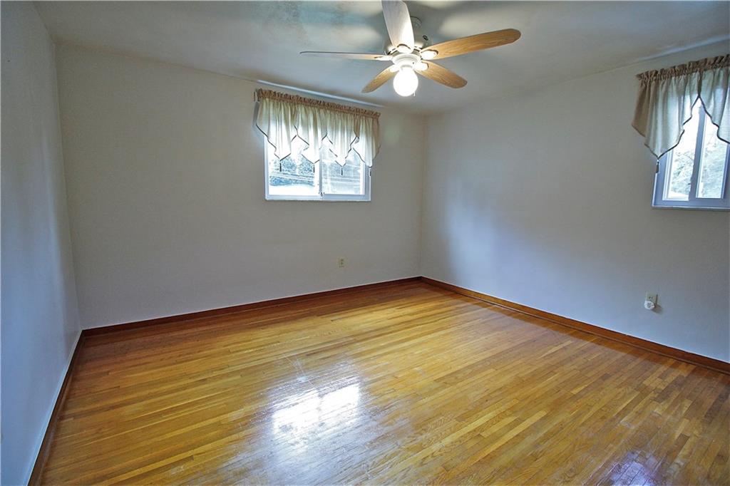 401 Pearce Road Pittsburgh, PA 15234 - Photo 7 of 20 Master bedroom has beautiful hardwood floors, new paint, and ceiling fan