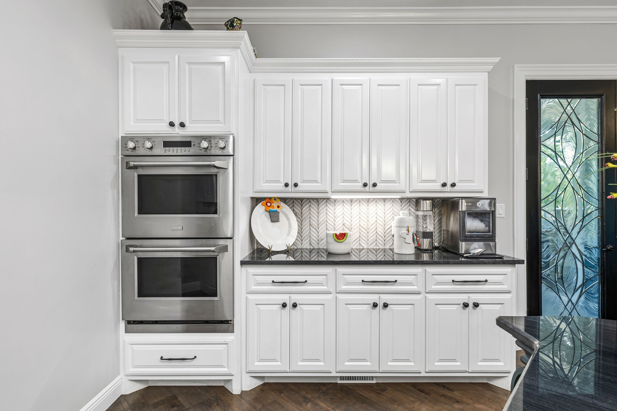 74 Pine Lake Road Summertown, TN 38483 - Photo 46 of 90 a kitchen with white cabinets and appliances