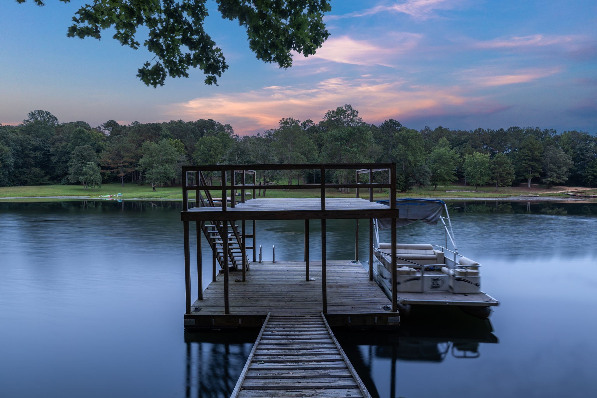 74 Pine Lake Road Summertown, TN 38483 - Photo 79 of 90 a view of a lake with a deck