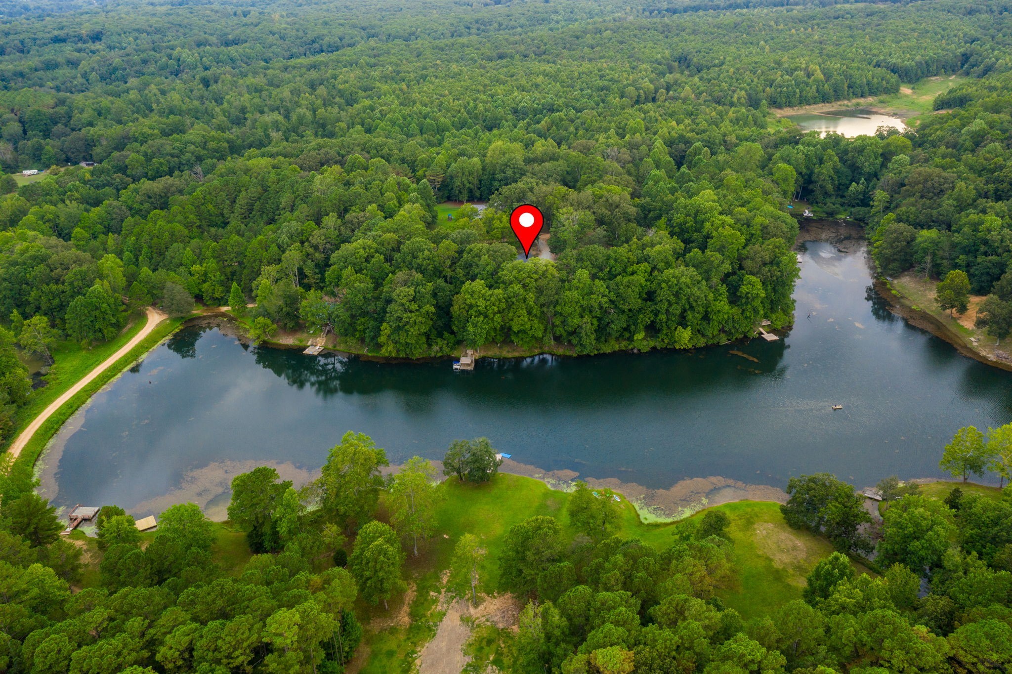 74 Pine Lake Road Summertown, TN 38483 - Photo 85 of 90 an aerial view of residential house with outdoor space and a lake view