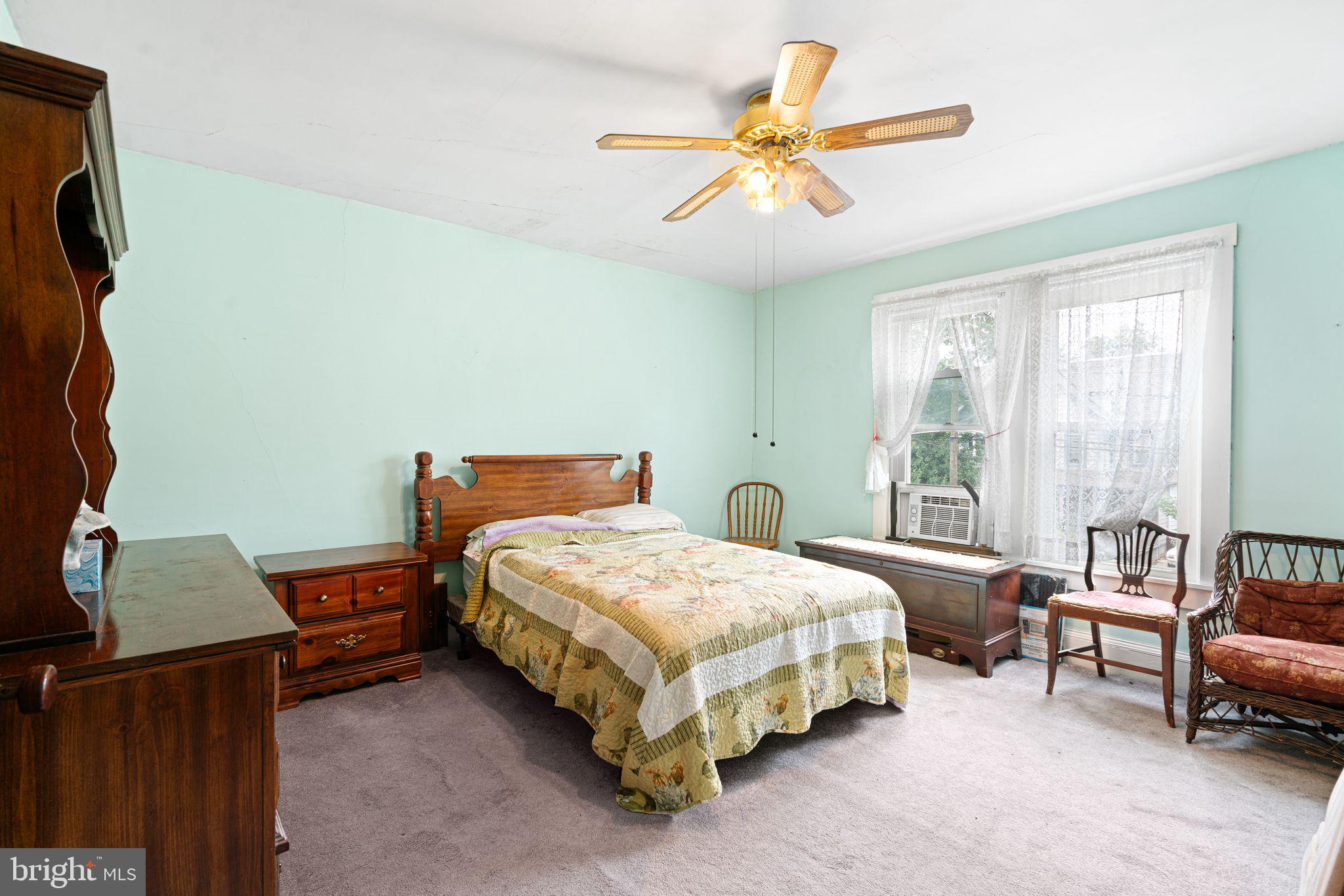 122 West Cottage Avenue Haddonfield, NJ 08033 - Photo 16 of 23 a bedroom with a bed and a chandelier